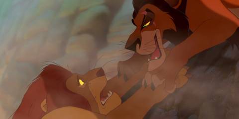 Scar about to let Mufasa fall down the cliff in The Lion King