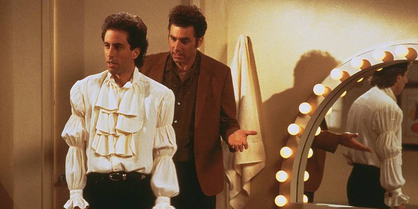 Jerry standing in a puffy shirt in Seinfeld