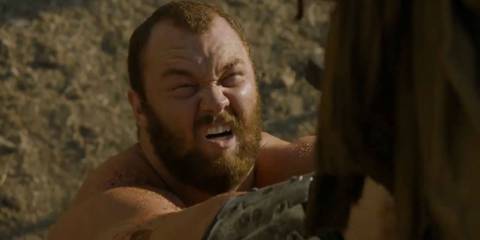 Gregor Clegane aka The Mountain lifting up a man with his sword in Game of Thrones