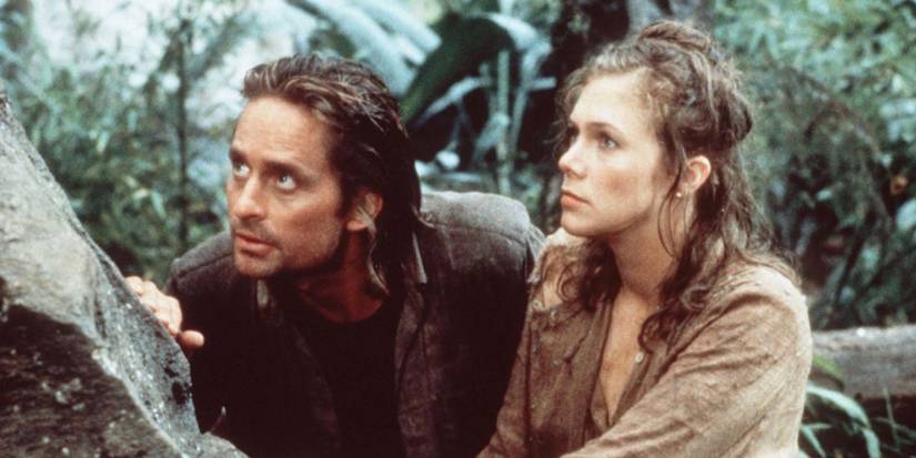 Michael Douglas and Kathleen Turner walk through the jungle in Romancing the Stone