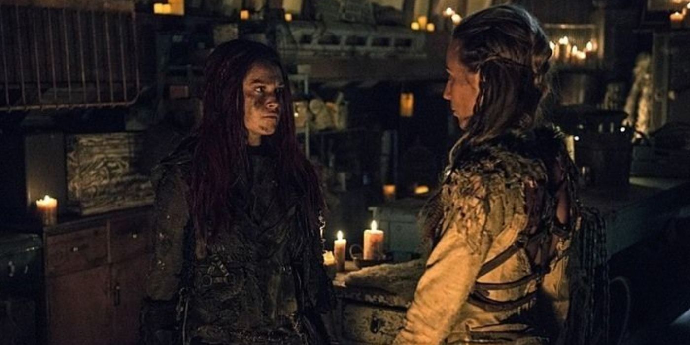 Clarke and Niylah talk at the trading post in The 100