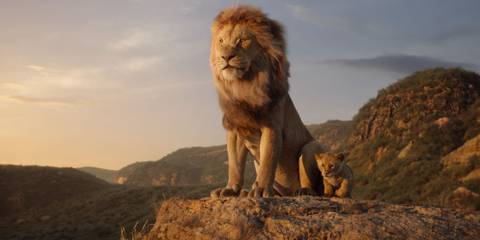 Mufasa and Simba atop Pride Rock looking to the distance in The Lion King 2019