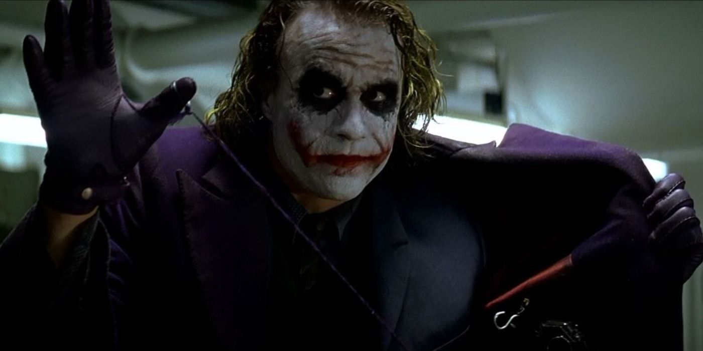 The Joker threatens to blow up the mobsters with his grenade jacket in The Dark Knight