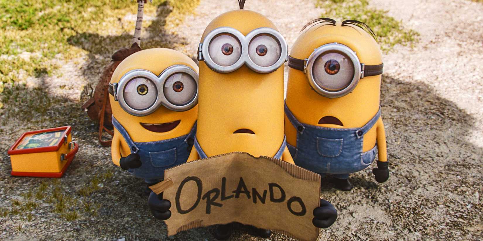 Three minions holding a sign for Orlando in Minions