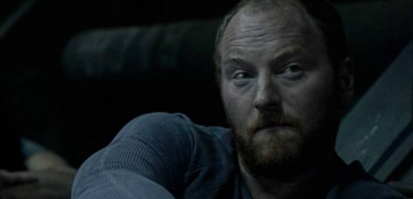 One man sits in the designated culling area of the Ark in The 100 S1E05