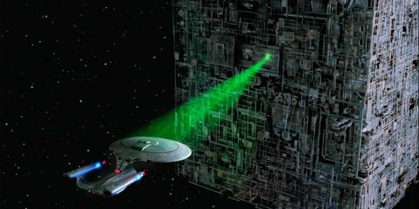 Enterprise in trapped in a beam from the Borg Cube 