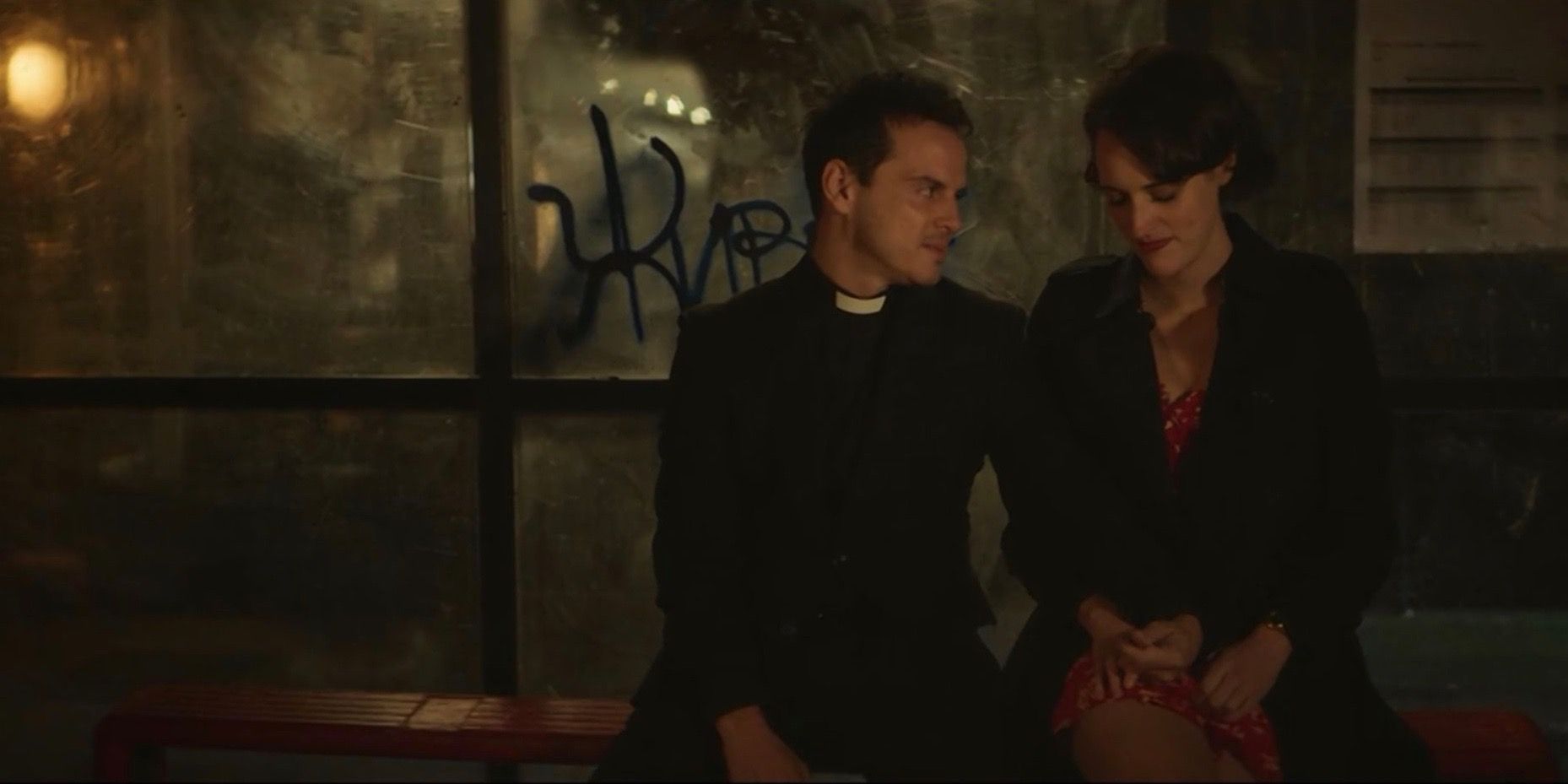 Phoebe Waller-Bridge as Fleabag and Andrew Scott as the priest sitting at a bus stop in the Fleabag finale