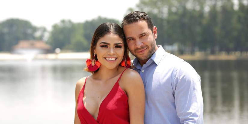 90 Day Fiance_ Fernanda Flores and Jonathan Rivera posing together on a sunny day in front of a body of water