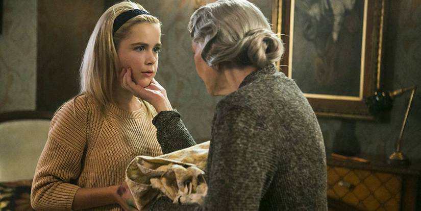 Flowers in the Attic (2014) scene of Olivia holding Cathy's face