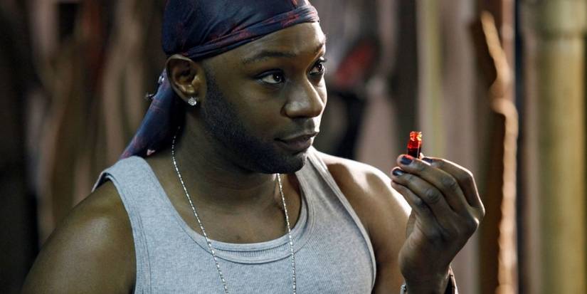 Lafayette Reynolds holding a vial of vampire blood