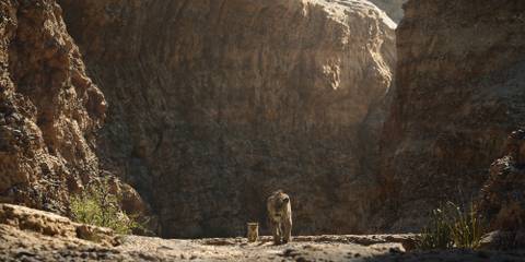 Scar and baby Simba walk side by side in The Lion King (2019)
