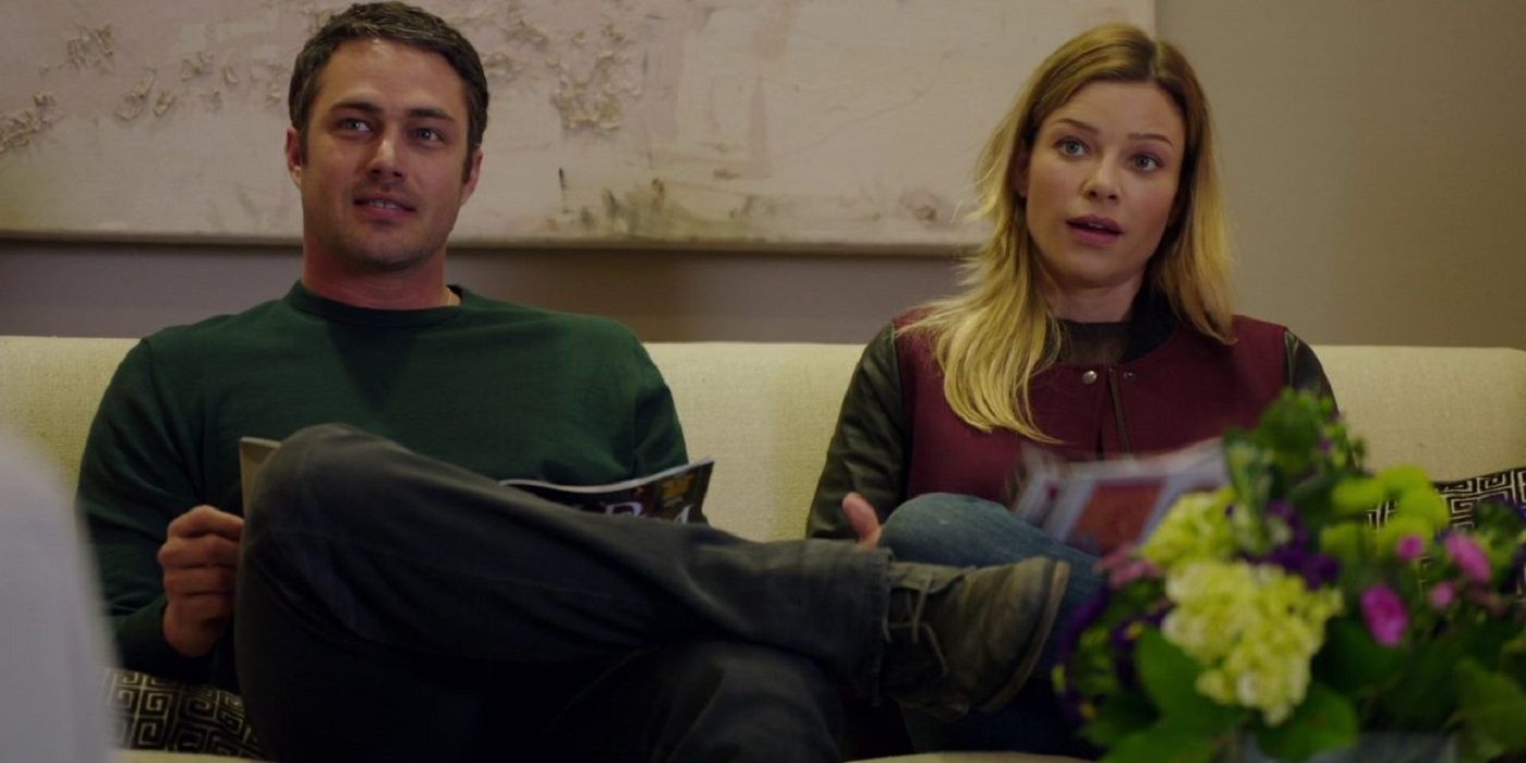 Severide (Taylor Kinney) and Shay (Lauren German) sitting together in Chicago Fire.