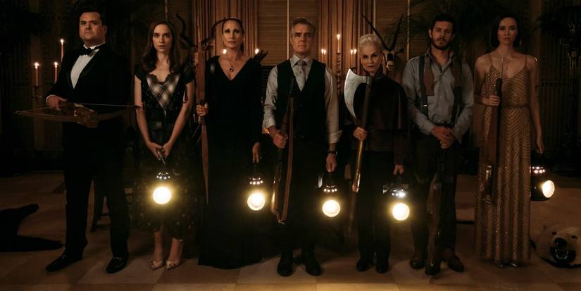 Andie MacDowell, Henry Czerny, Adam Brody, Nicky Guadagni, Elyse Levesque, Kristian Bruun and Melanie Scrofan as the Le Domas family, standing with weapons and lanterns in Ready or Not