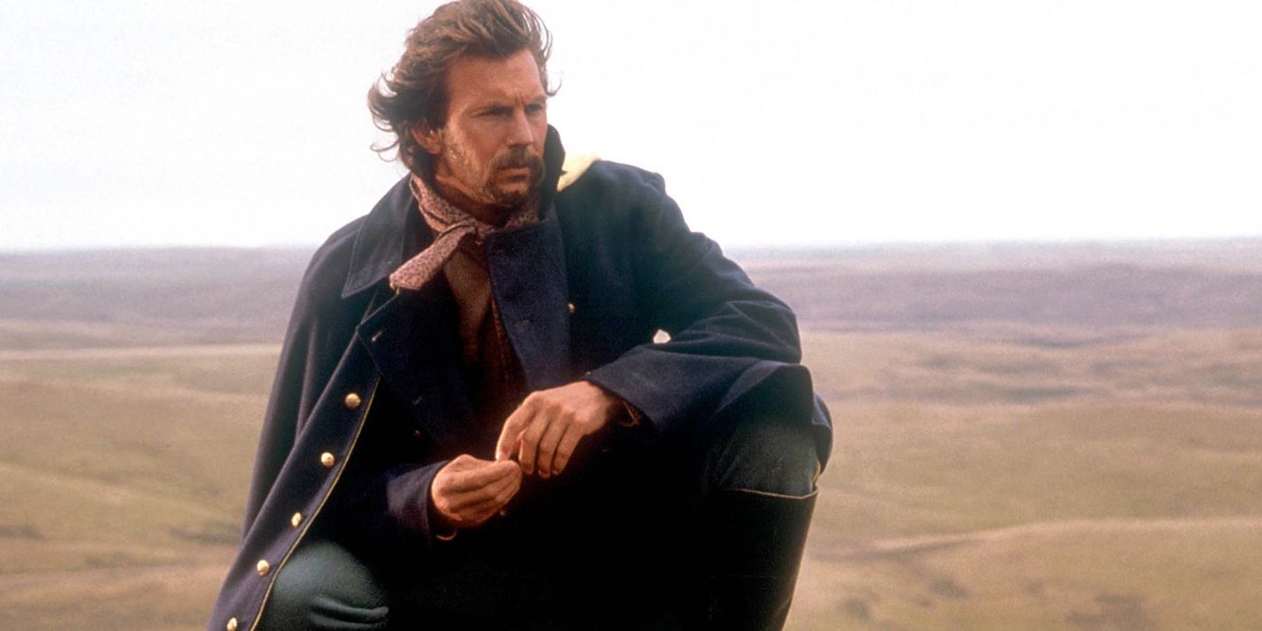 Kevin Costner kneeling and looking out over the landscape in Dances with Wolves (1990)