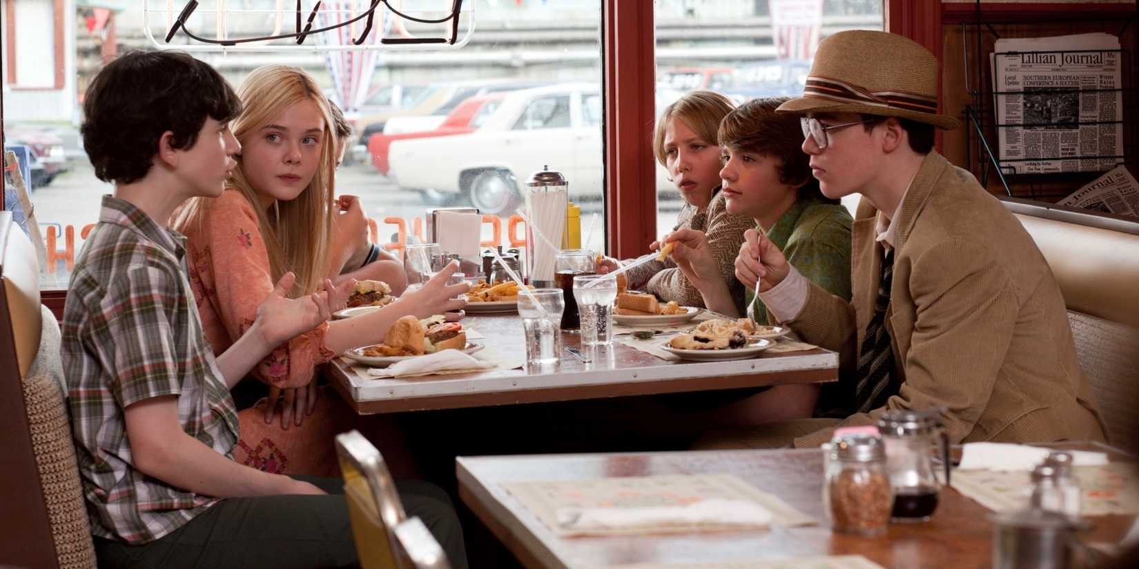 Riley Griffiths, Joel Courtney, Gabriel Bᴀsso, Zach Mills, Ryan Lee, and Elle Fanning as Charles, Joe, Martin, Preston, Alice, and Cary in Super 8