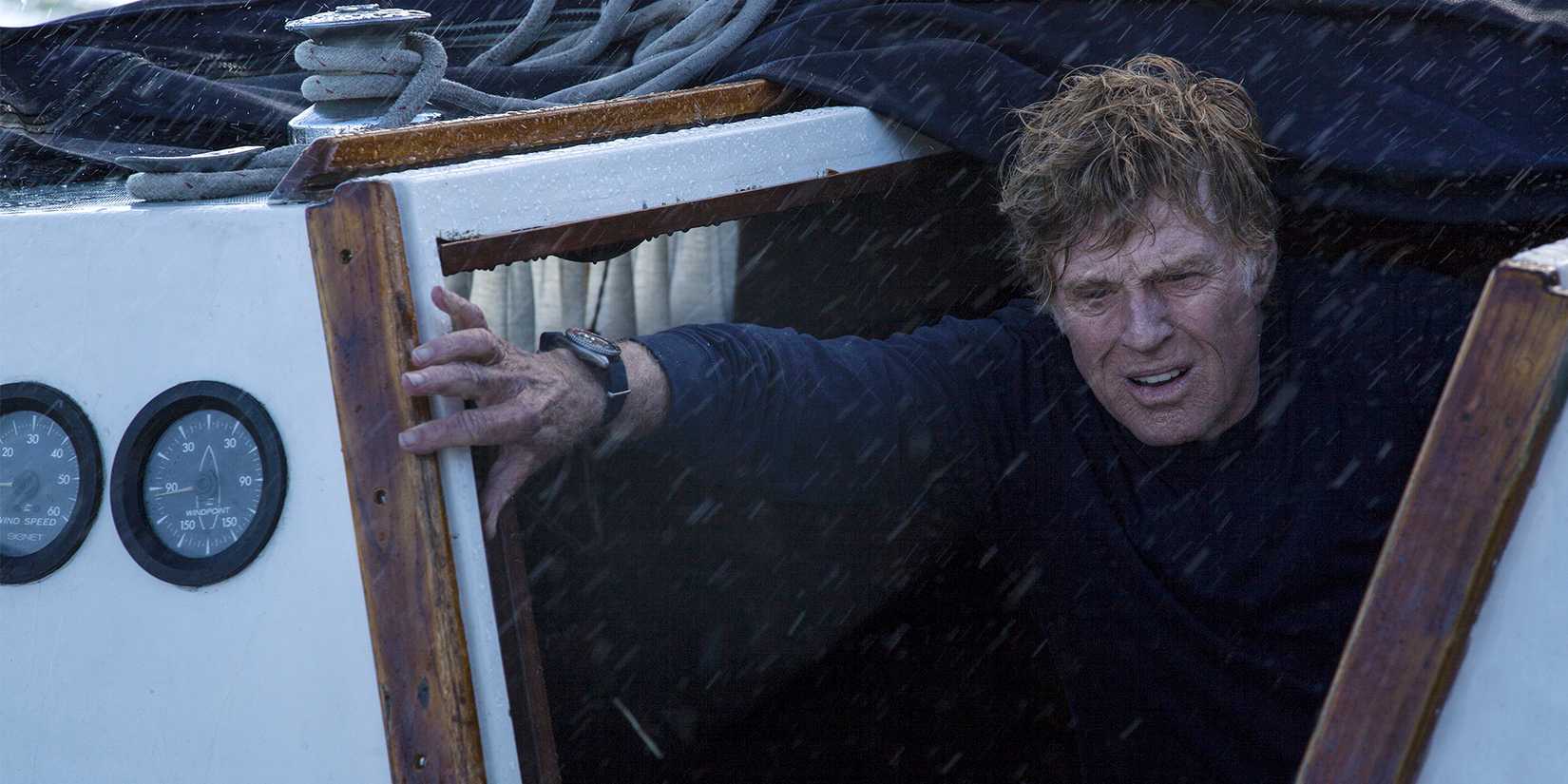 Robert Redford climbing out from under a boat in All is Lost