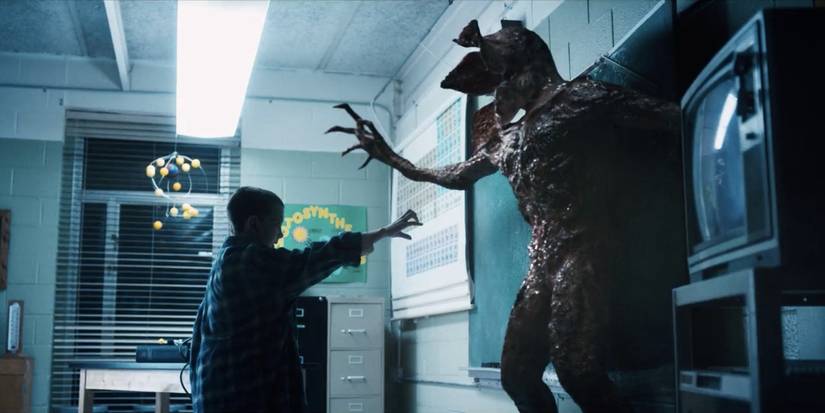 Eleven fighting the Demogorgon in a classroom in Stranger Things