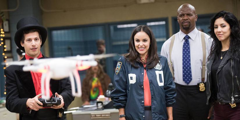 Jake flies a drone as Amy, Terry, and Rosa look on in Brooklyn Nine Nine