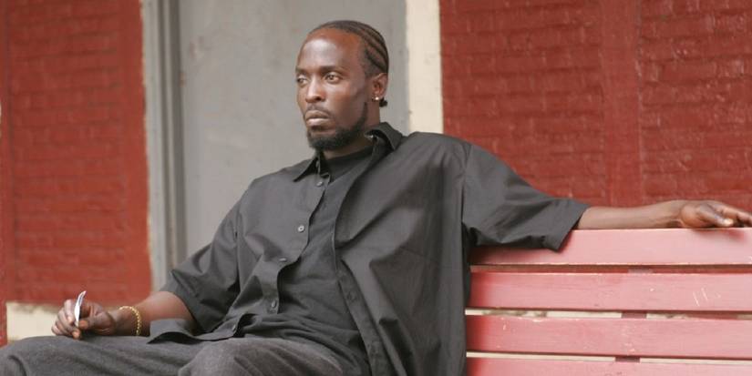 Omar sitting on a bench in The Wire