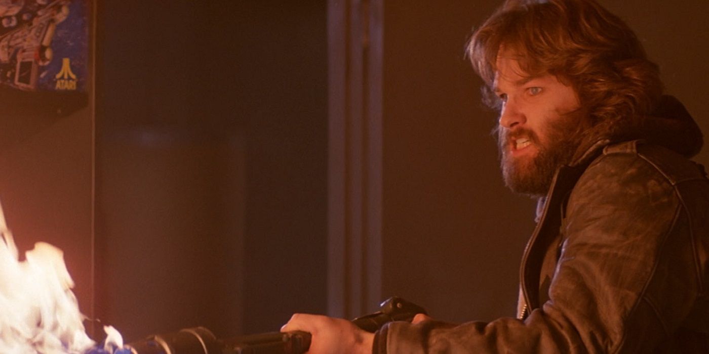 Kurt Russell as MacReady firing a flamethrower in The Thing