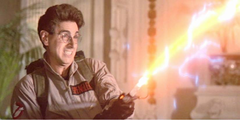 Harold Ramis as Spengler firing his weapon in Ghostbusters