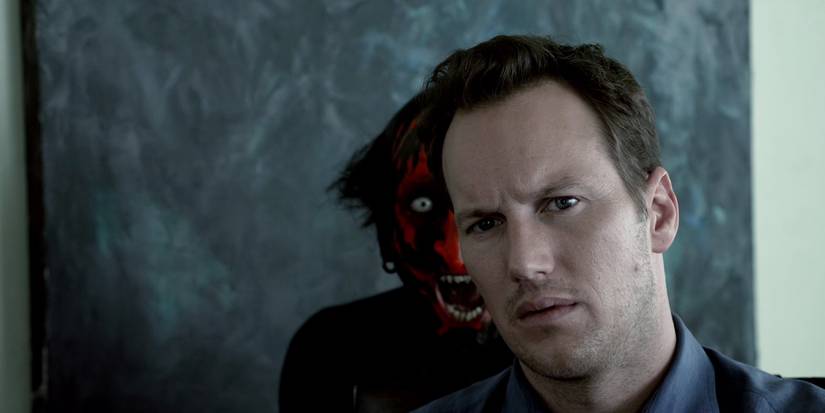 Patrick Wilson in Insidious (2010) with the Red Demon appearing behind him.