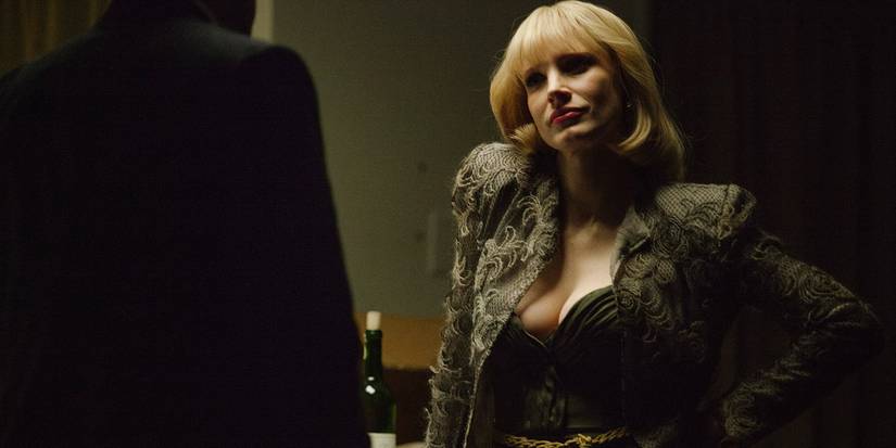 Oscar Isaac & Jessica Chastain's Chemistry In A Most Violent Year Previewed Their HBO Series 1 Anna with her hand on her waist in A Most Violent Year