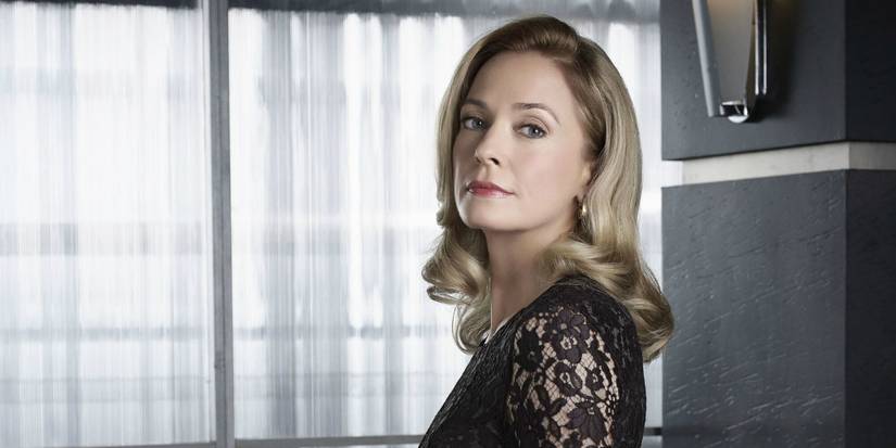 Moira Queen looks at her son