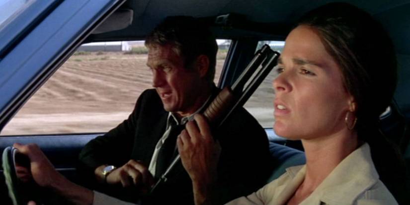 Steve McQueen loading a shotgun and Ali MacGraw driving in The Getaway
