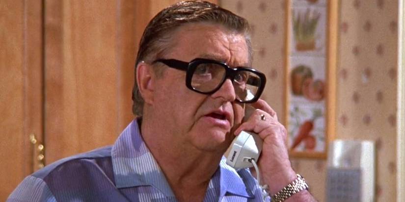 Morty talking on the phone in his kitchen on Seinfeld