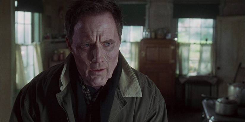 Robert Burke emaciated and standing indoors in Thinner