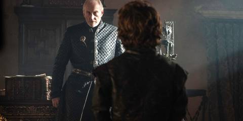 Charles Dance as Tywin Lannister towering over Peter Dinklage's Tyrion Lannister