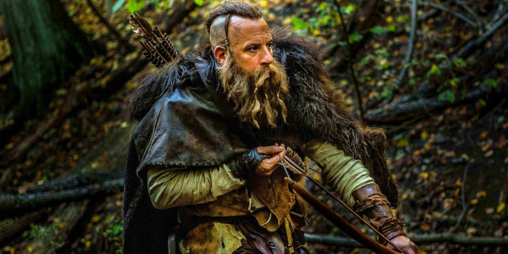 Kaulder draws his bow while stalking through the woods in The Last Witch Hunter