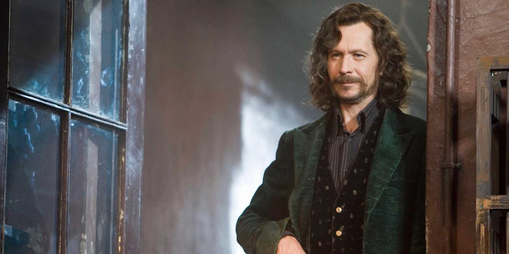 Sirius Black leaning against an open door and smiling in Harry Potter and the Order of the Phoenix.