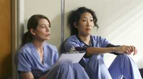 Meredith Grey and Cristina Yang sitting together in Grey's Anatomy