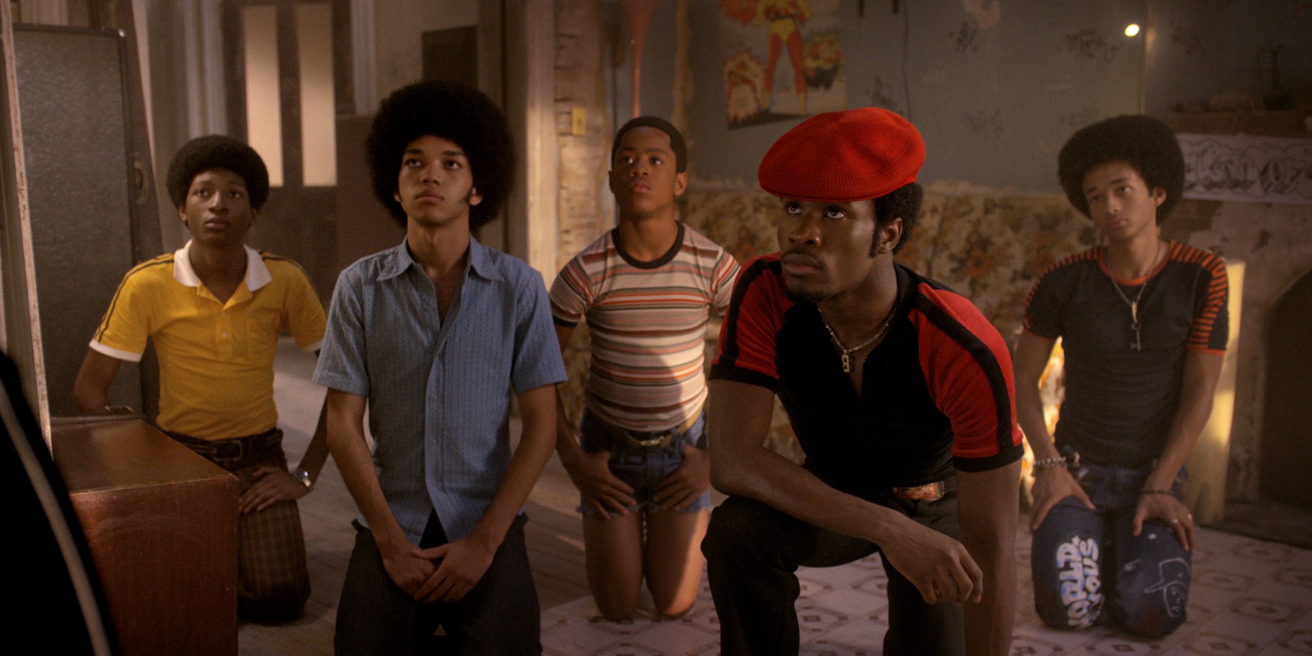 The main cast of The Get Down kneels on the floor