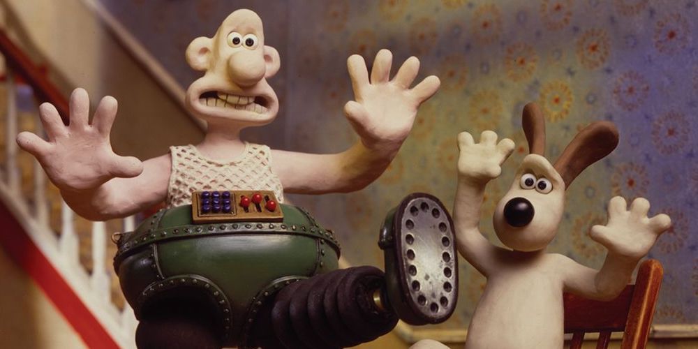 Wallace wearing mechanica pants while Gromit looks in awe, a still from The Wrong Trousers