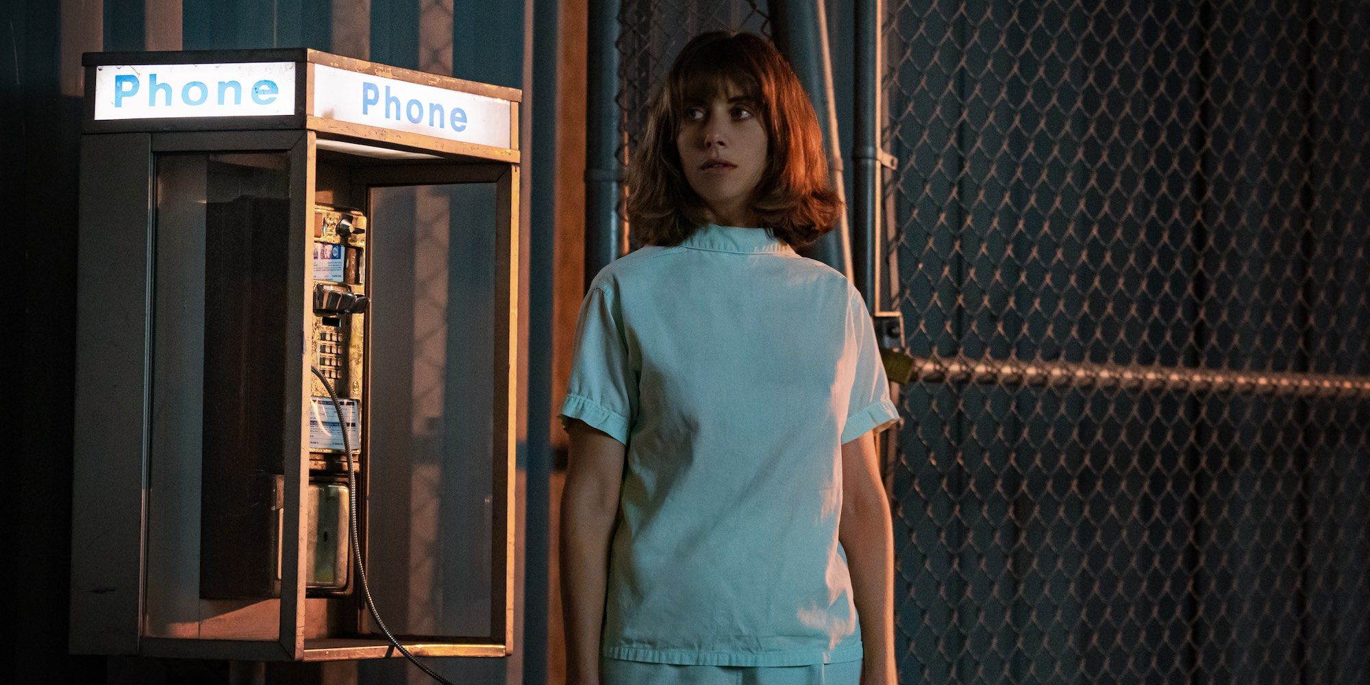 Alison Brie next to a payphone in Netflix's Horse Girl movie