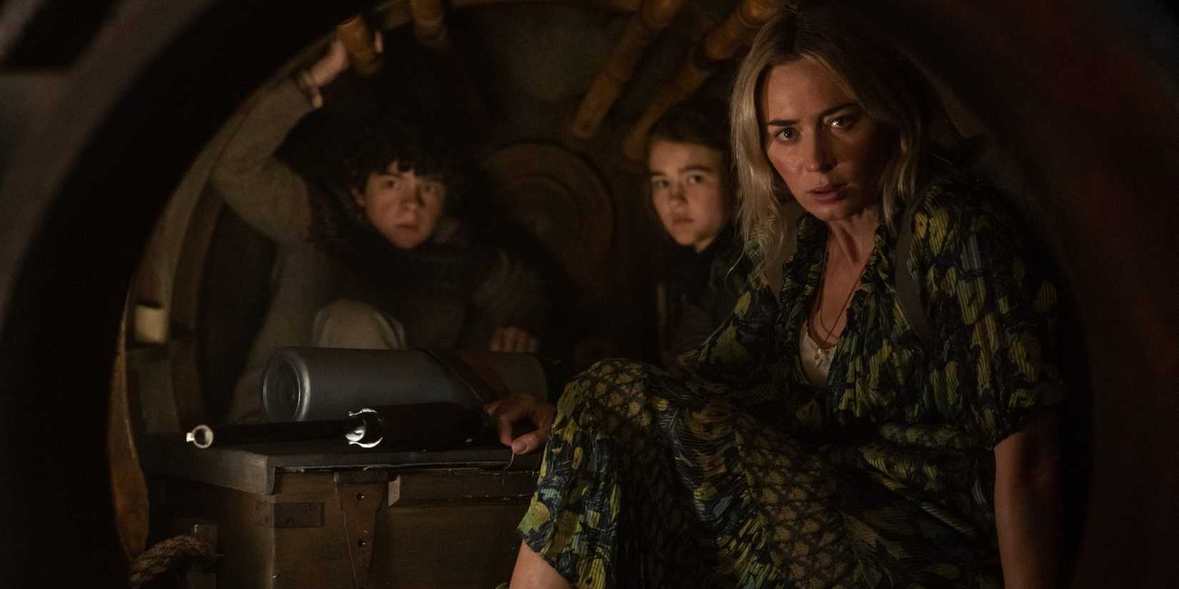 Noah Jupe Millicent SImmonds and Emily Blunt looking scared in A Quiet Place 2
