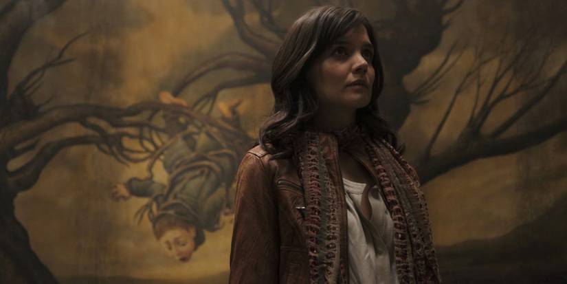 Kim (Katie Holmes) looking at a creepy painting in Don't Be Afraid of the Dark.