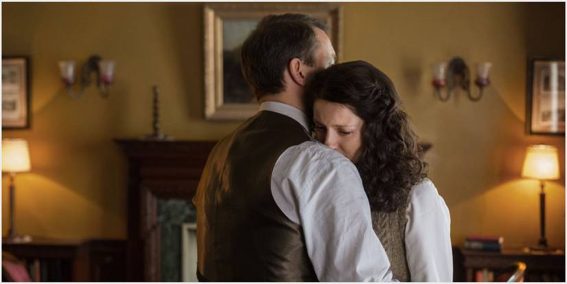 Claire and Frank hugging in Outlander