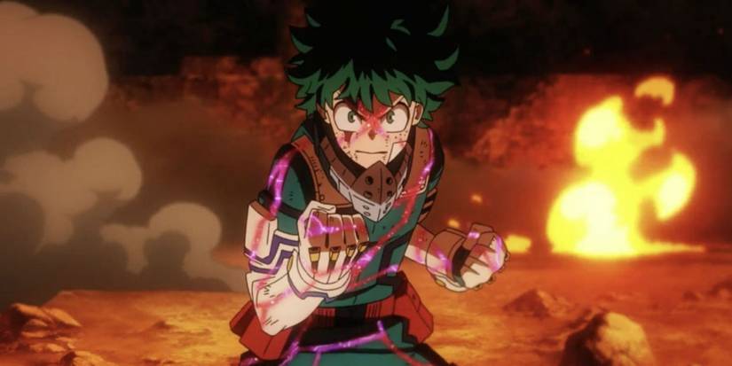 My Hero Academia's Deku clenching his fist in determination as purple energy flows around him.