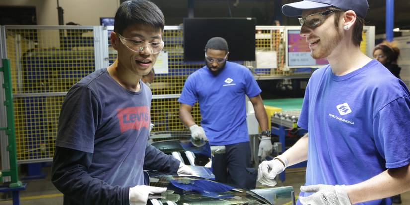 Workers smiling in American Factory (2019)