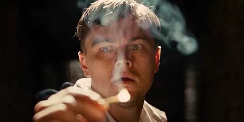 Leonardo DiCaprio holding a match in Shutter Island (2010)