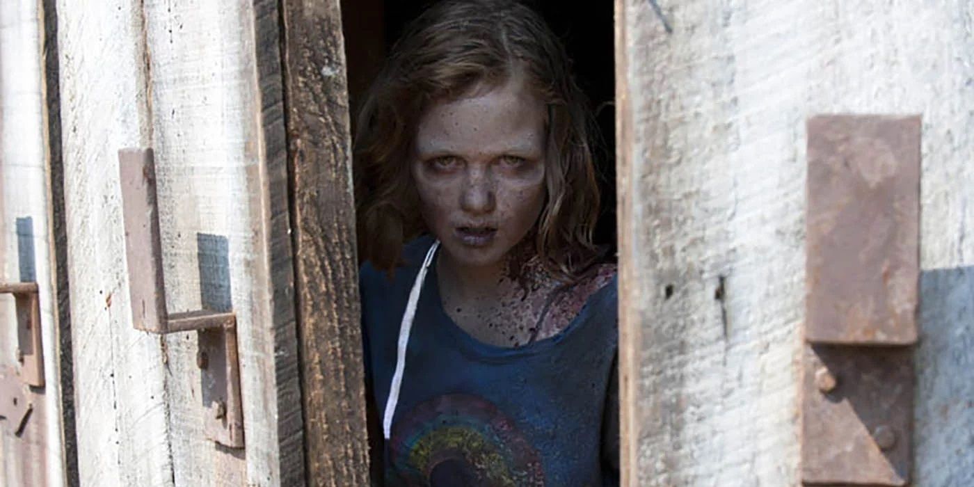 Zombie Sophia coming out of the barn in The Walking Dead season 2.