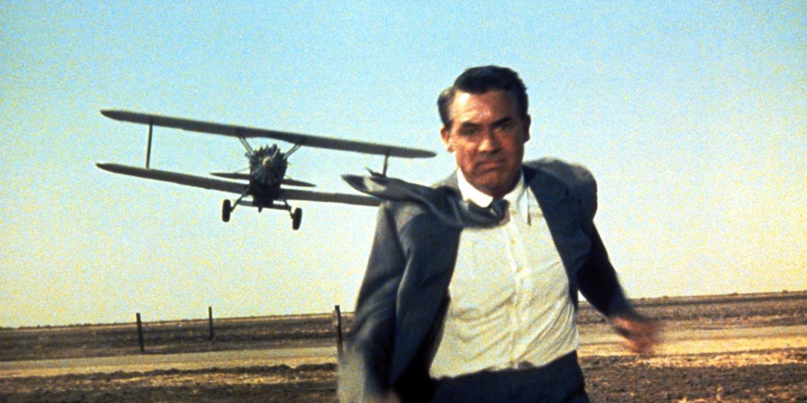 Cary Grant running across a field, fleeing a plane in North by Northwest