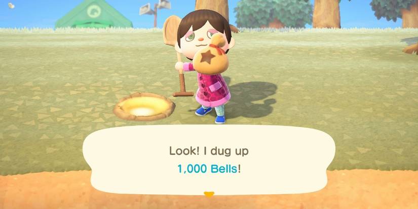 The player standing with a bag of bells after having dug it out of the ground in Animal Crossing: New Horizons.
