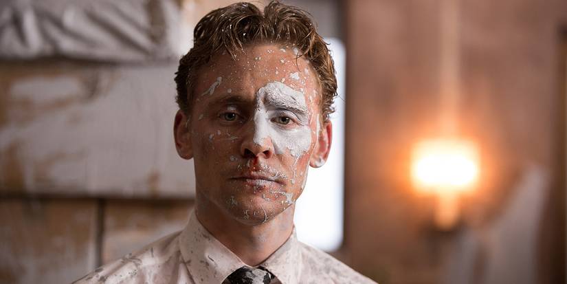 Robert’s face is covered in paint in High-Rise