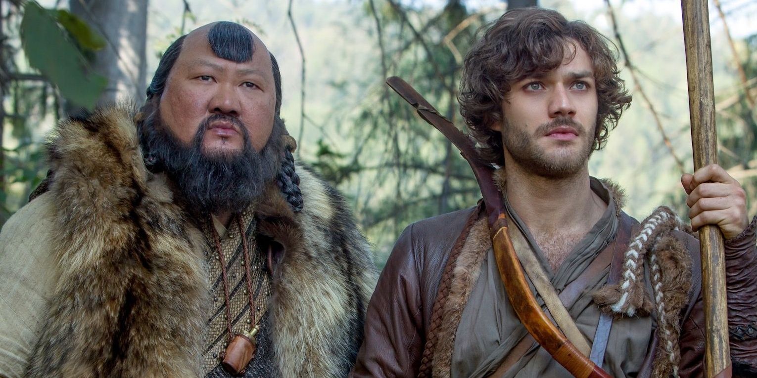 Benedict Wong as Kublai and Lorenzo Richelmy as Marco in a forest in Marco Polo.