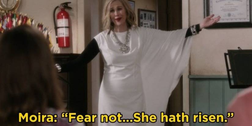 Moira (Catherine O'Hara) welcomes everyone by saying she has risen in Schitt's Creek